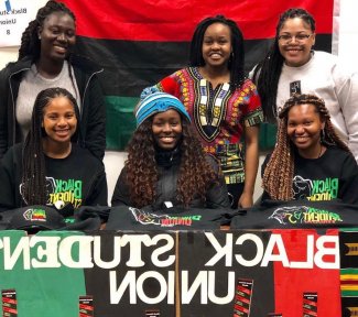 Students at a booth for the Black Student Union